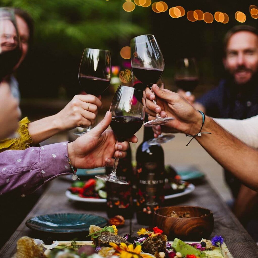 Group drinking wine and eating together in San Luis Obispo.