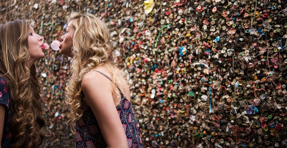 Girls blowing bubblegum bubbles in Bubblegum Alley