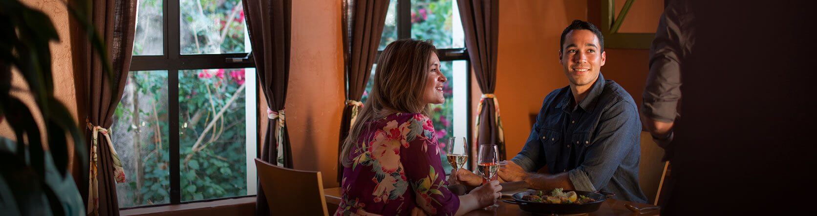 man and woman having dinner together