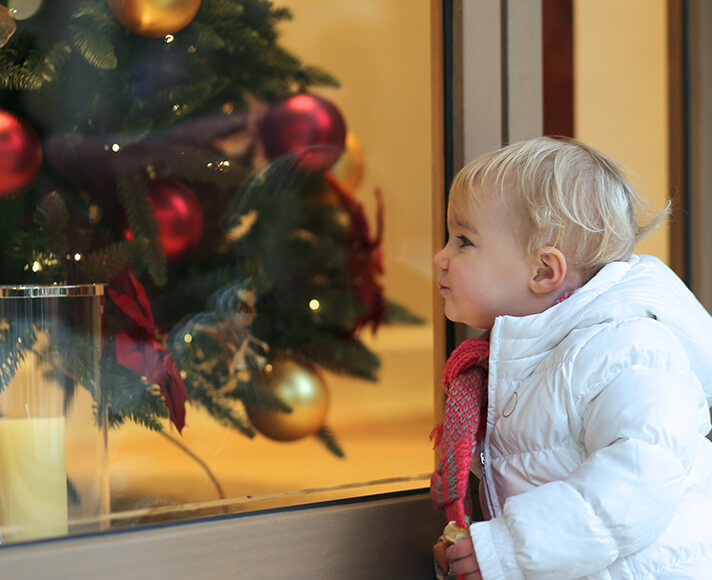 Child looks at a winter time display in San Luis Obispo, CA