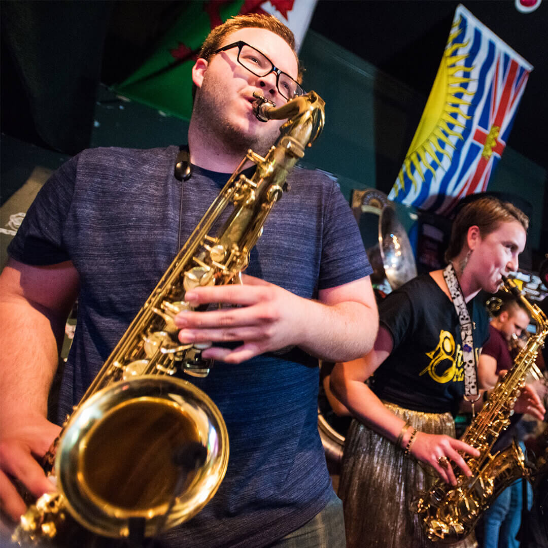 Saxaphone player with band at a local SLO bar