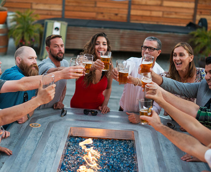 Friends enjoying beer together at Tap It Brewery in San Luis Obispo, California