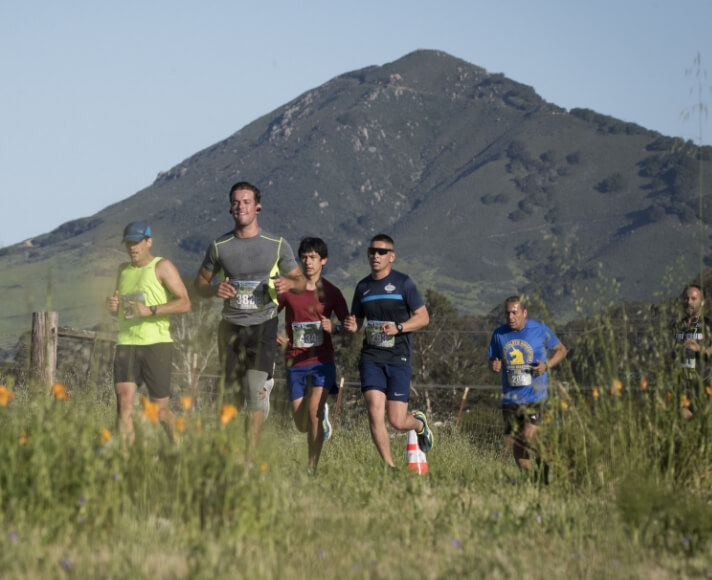 Runners running on SLO backroads