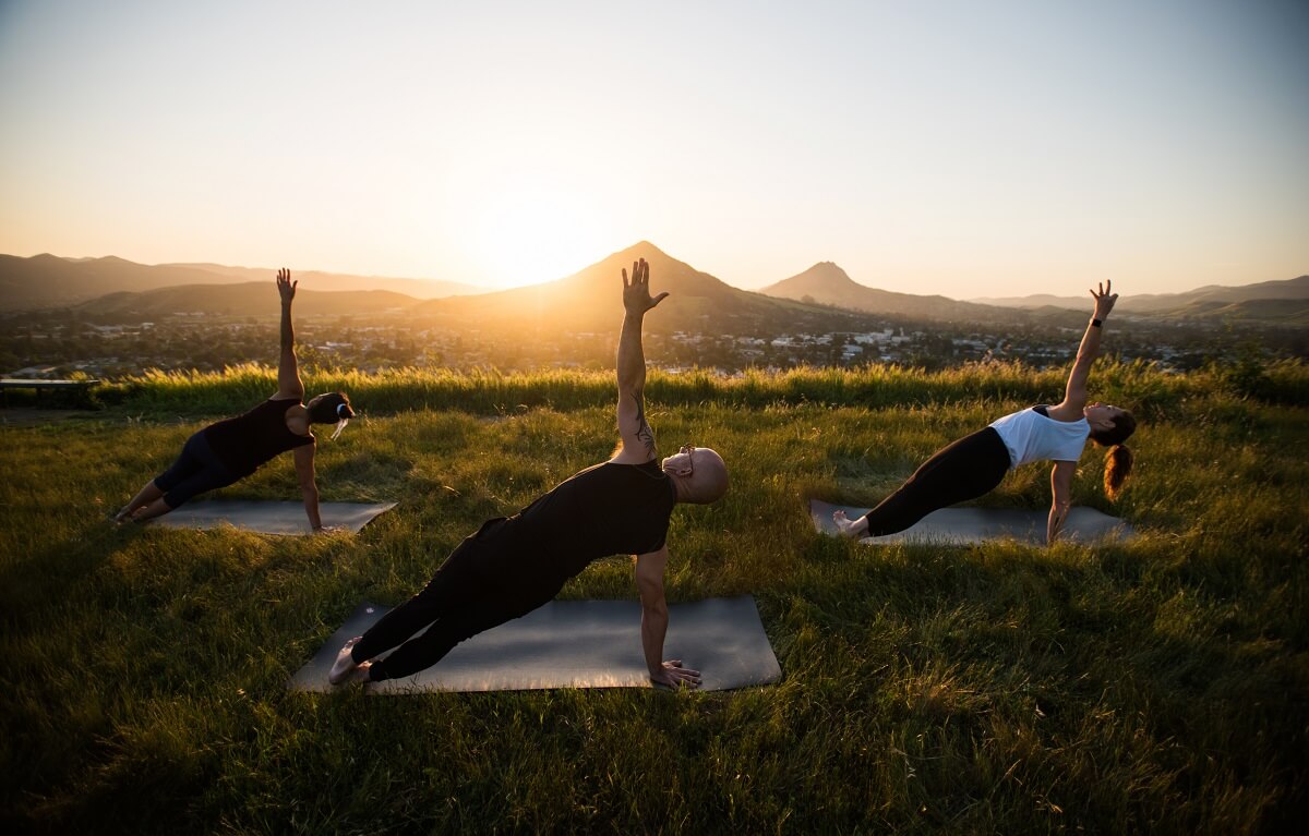 People doing yoga at sunset on Terrace Hill in San Luis Obispo, California